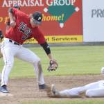 Oilers shortstop Skyler Messinger records a force out on Pate Fullerton before throwing to first base for a double play Sunday, June 16, 2019, at Coral Seymour Memorial Park in Kenai, Alaska. (Photo by Jeff Helminiak/Peninsula Clarion)