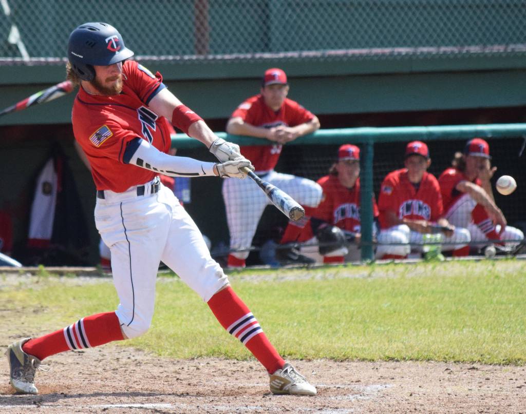 The Twins David Michael swings at a pitch by Services Andrew Jaidinger Saturday, June 22, 2019, at Coral Seymour Memorial Park in Kenai. (Photo by Joey Klecka/Peninsula Clarion)