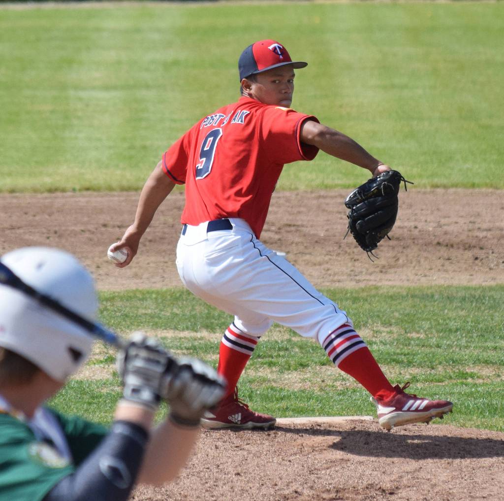 Legion Twins pitcher Harold Ochea offers up a pitch Saturday, June 22, 2019, to a Service batter at Coral Seymour Memorial Park in Kenai. (Photo by Joey Klecka/Peninsula Clarion)