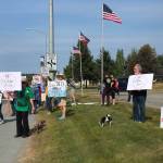 Residents line the Sterling Highway, in front of Sen. Lisa Murkowskis office to oppose Pebble mine on Wednesday, June 26, 2019, in Soldotna, Alaska. (Photo by Victoria Petersen/Peninsula Clarion)