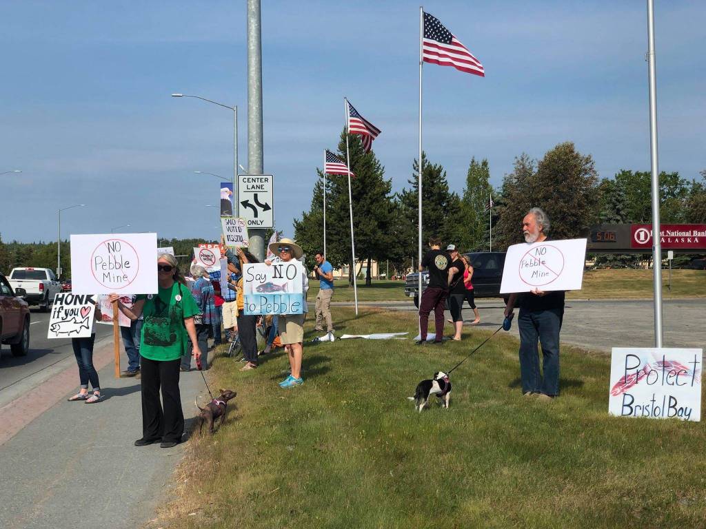 Residents line the Sterling Highway, in front of Sen. Lisa Murkowskis office to oppose Pebble mine on Wednesday, June 26, 2019, in Soldotna, Alaska. (Photo by Victoria Petersen/Peninsula Clarion)