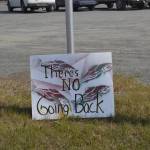 A sign opposing Pebble mine sits in front of Sen. Lisa Murkowskis Soldotna office during a rally against Pebble mine on Wednesday, June 26, 2019, in Soldotna, Alaska. (Photo by Victoria Petersen/Peninsula Clarion)