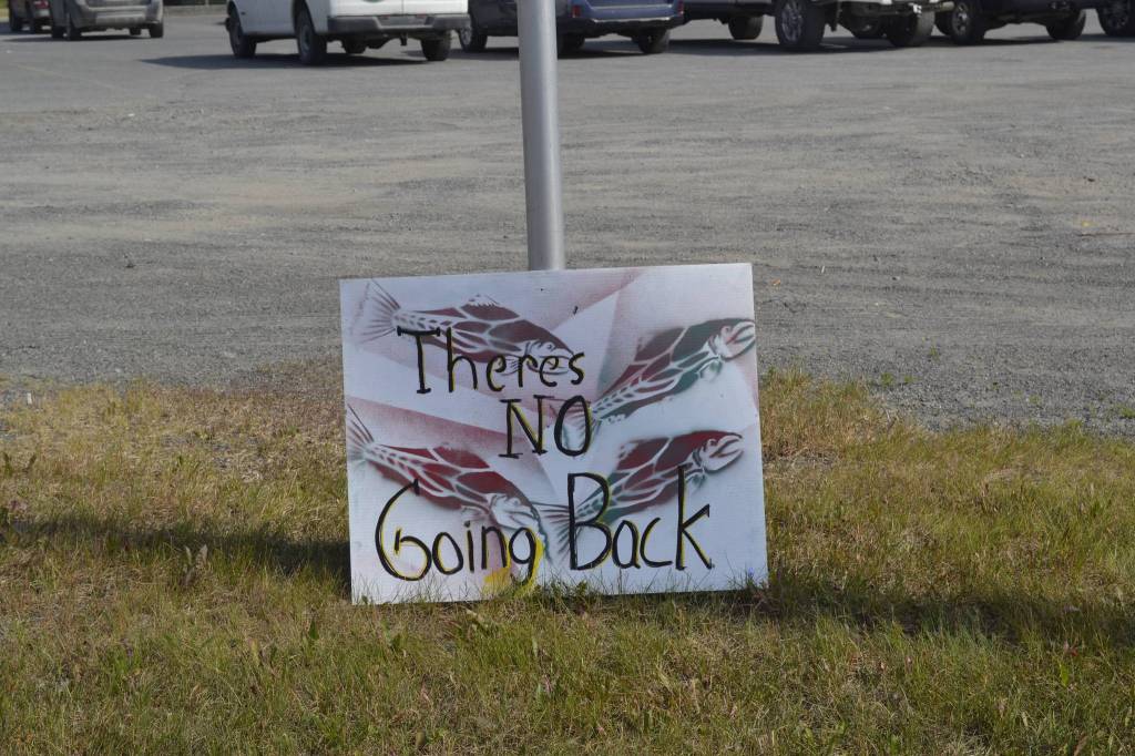 A sign opposing Pebble mine sits in front of Sen. Lisa Murkowskis Soldotna office during a rally against Pebble mine on Wednesday, June 26, 2019, in Soldotna, Alaska. (Photo by Victoria Petersen/Peninsula Clarion)