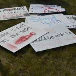 Ready-made signs awaited residents at a rally against Pebble mine in front of Sen. Lisa Murkowskis Soldotna office on Wednesday, June 26, 2019, in Soldotna, Alaska. (Photo by Victoria Petersen/Peninsula Clarion)