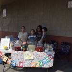 From left, Addison, Isabella, Bri and Emma Havrilla smile for the camera at their lemonade stand outside of Sportsmans Warehouse during Lemonade Day in Soldotna, Alaska on June 29, 2019. (Photo by Brian Mazurek/Peninsula Clarion)