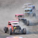 Dallas Dalton in the #4 Legends car leads a group of racers around a turn Saturday, June 29, 2019, at Twin Cities Raceway in Kenai, Alaska. (Photo by Joey Klecka/Peninsula Clarion)