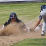 The Twins David Michael safely slides into second base ahead of the tag of Eagle Rivers Devin Wilcox (right) Tuesday at the Bill Miller Big Fish Wood Bat Tournament at Coral Seymour Memorial Park in Kenai. (Photo by Joey Klecka/Peninsula Clarion