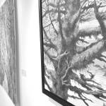 Mossy Tree at Williwaw, an acrylic painting by Chelline Larsen, hangs Tuesday at the Kenai Fine Art Center in Kenai. (Photo by Joey Klecka/Peninsula Clarion)