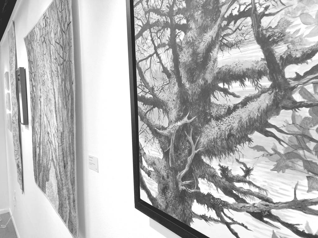 Mossy Tree at Williwaw, an acrylic painting by Chelline Larsen, hangs Tuesday at the Kenai Fine Art Center in Kenai. (Photo by Joey Klecka/Peninsula Clarion)