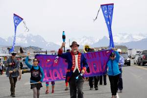 The New Old Time Chautauqua Fighting Instruments of Karma Marching Chamber Band Orchestra marches on the Homer Spit on July 2, 2019, in Homer, Alaska. The group visited Homer as part of a week-long tour partially funded by the Rasmuson Foundations Harper Arts Touring Fund, administered by the Alaska State Council on the Arts  an example of state-foundation cooperation in arts funding. (Photo by Michael Armstrong/Homer News)