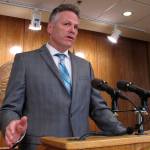Alaska Gov. Mike Dunleavy speaks to reporters about his budget vetoes at the state Capitol in Juneau, Alaska Friday, June 28, 2019. The university system, health and social service programs and public broadcasting were among the areas affected by vetoes. The budget agreed to by the House and Senate cut state support for the university system by a fraction of what Dunleavy proposed. Lawmakers have the ability to override budget vetoes if they can muster sufficient support. (AP Photo/Becky Bohrer)