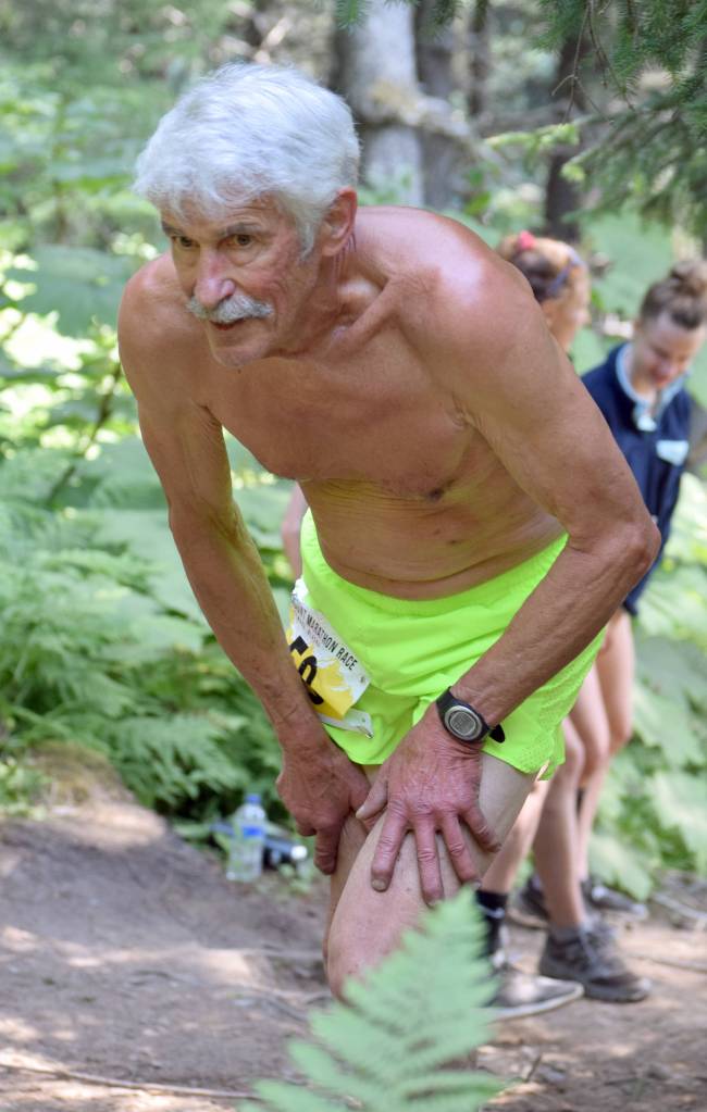 Sewards Fred Moore starts up the mountain on the way to completing his 50th straight Mount Marathon Race on Thursday, July 4, 2019, in Seward, Alaska. (Photo by Jeff Helminiak/Peninsula Clarion)