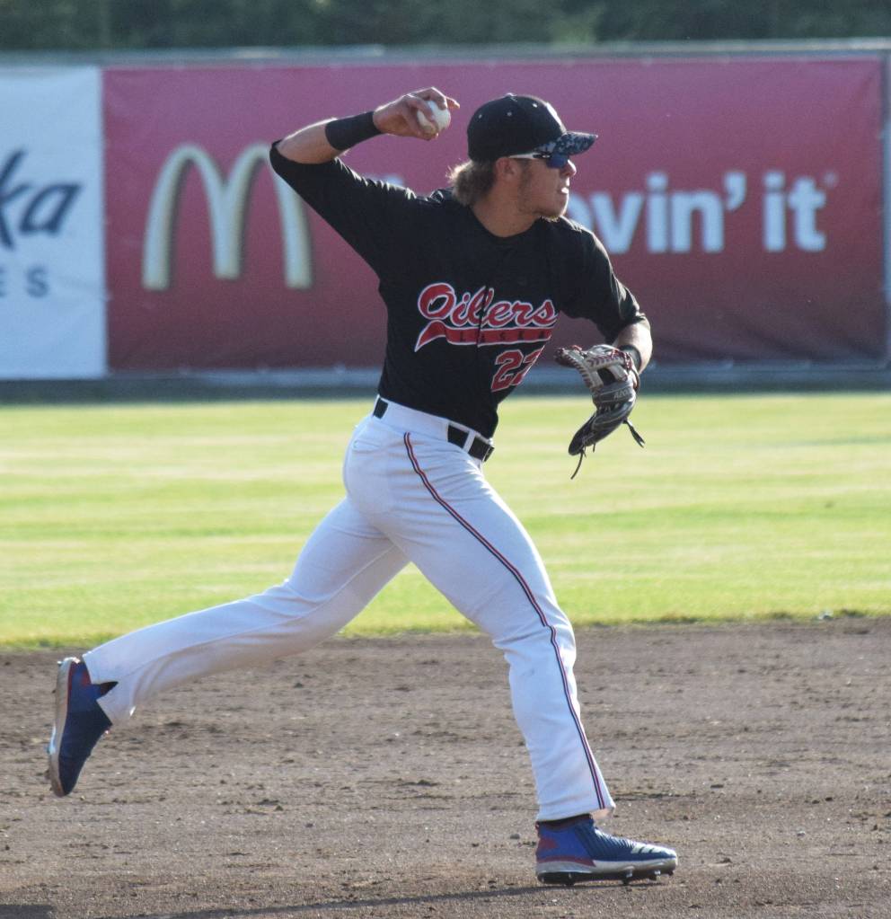 Peninsula Oilers shortstop Skyler Messinger delivers a throw to first on a Mat-Su Miners grounder Friday at Coral Seymour Memorial Park in Kenai. (Photo by Joey Klecka/Peninsula Clarion)