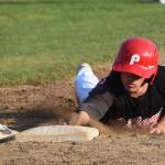 Peninsula Oilers baserunner Paul Steffensen tags first base to avoid the glove of Mat-Su Miners first baseman Drew Williamson Friday at Coral Seymour Memorial Park in Kenai. (Photo by Joey Klecka/Peninsula Clarion)
