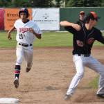 Twins pinch runner Chris Jaime jogs into third base Monday, July 8, 2019, behind Wests Quinn Bates Janigo at Coral Seymour Memorial Park in Kenai, Alaska. (Photo by Joey Klecka/Peninsula Clarion)