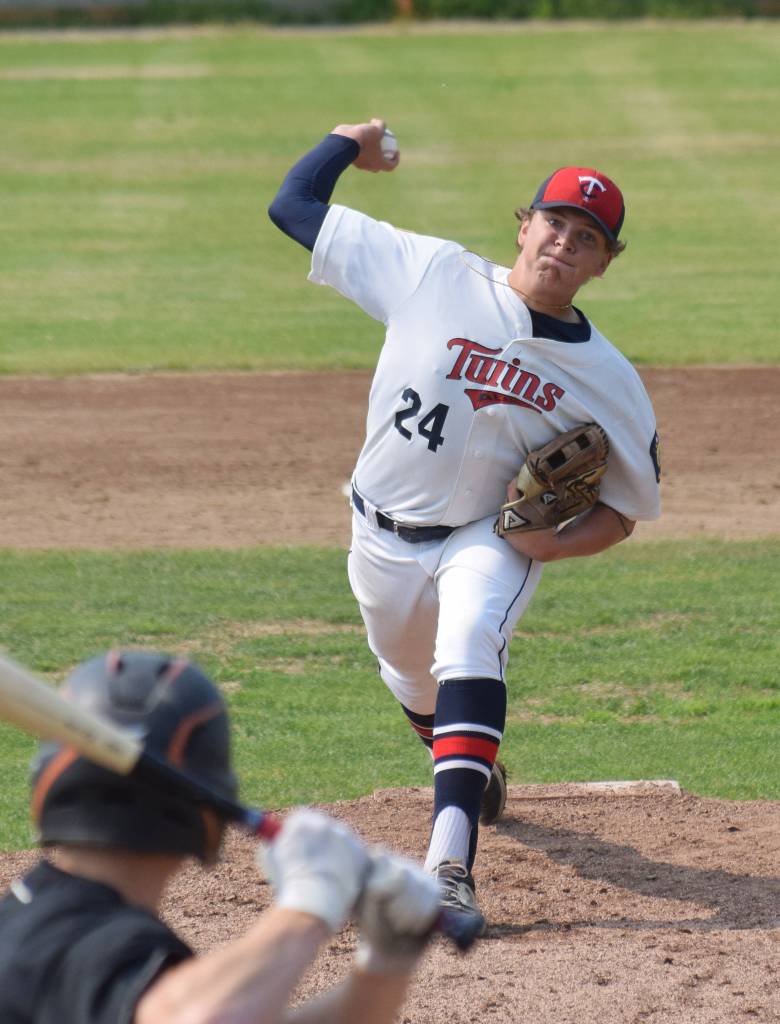 Twins pitcher Logan Smith unleashes an offering for West batter Jack Opinsky Monday, July 8, 2019, at Coral Seymour Memorial Park in Kenai, Alaska. (Photo by Joey Klecka/Peninsula Clarion)