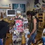 Brian Mazurek / Peninsula Clarion                                Localz owner Angel Stanton, right, shows Heidi Vann some of the products featured in her store Thursday in Nikiski.