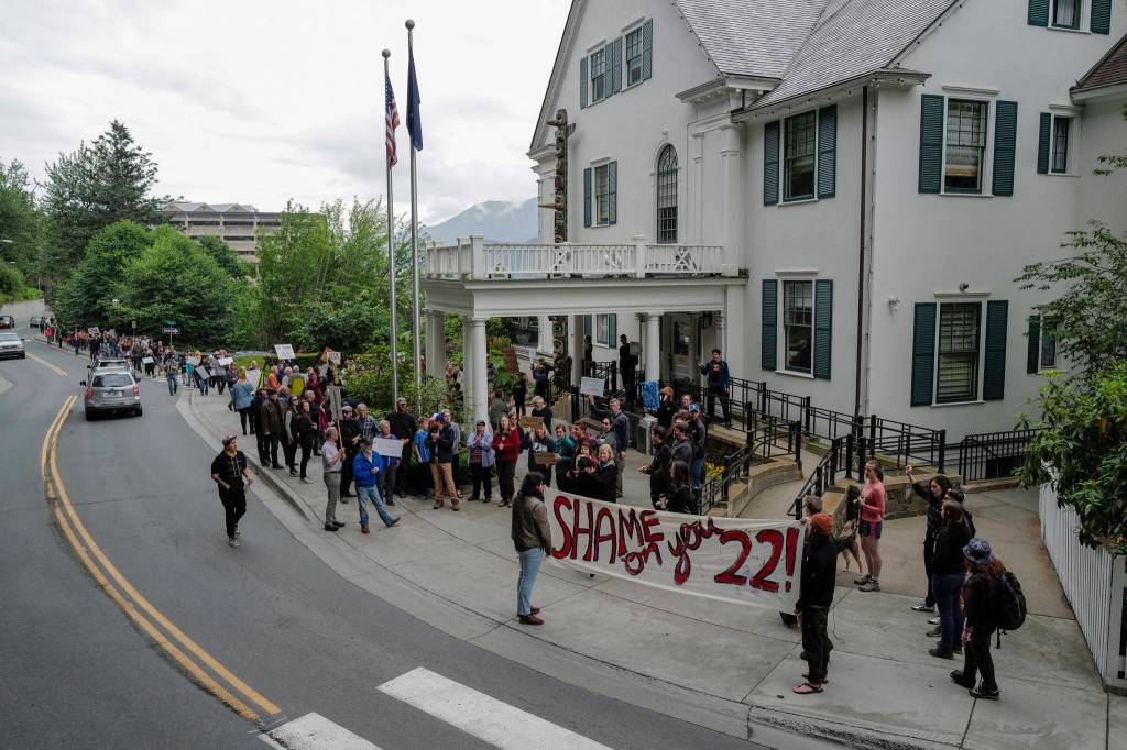 Over hundred people gather in front of the Governors Mansion to protest budget vetoes by Gov. Mike Dunleavy on Friday, July 12, 2019. (Michael Penn | Juneau Empire)