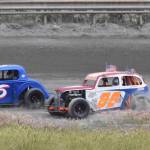 Bryan Barber (right) tries to pass Brent Romagoux Saturday, July 13, 2019, at Twin City Raceway in Kenai, Alaska. (Photo by Joey Klecka/Peninsula Clarion)
