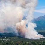 A brush fire burns in South Anchorage, Alaska, Tuesday, July 2, 2019. (Loren Holmes/Anchorage Daily News via AP)