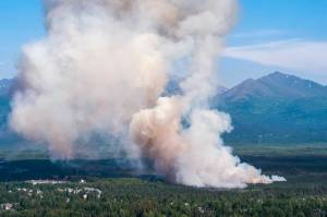 A brush fire burns in South Anchorage, Alaska, Tuesday, July 2, 2019. (Loren Holmes/Anchorage Daily News via AP)