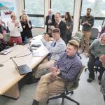 Michael Penn | Juneau Empire                                University of Alaska Southeast administrators and staff applaud a speech by Sen. Click Bishop, R-Fairbanks, as they watch an online meeting being held Monday at UA campuses around the state on Gov. Mike Dunleavys budget cuts.