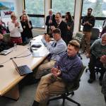 University of Alaska Southeast administrators and staff applaud a speech by Sen. Click Bishop, R-Fairbanks, as they watch an online meeting being held at UA campuses around the state on Gov. Mike Dunleavys budget cuts on Monday, July 15, 2019. (Michael Penn | Juneau Empire)