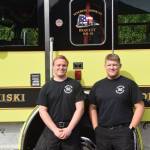 Volunteers Brandon Edwards, left, and Vlad Glushkov, right, smile for the camera at Fire Station #2 during the Nikiski Fire Departments 50th anniversary celebration in Nikiski, Alaska on July 15, 2019. (Photo by Brian Mazurek/Peninsula Clarion)