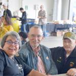 Brian Mazurek/Peninsula Clarion                                From left, Terry Carter, Dave Unruh, and Dan Gregory smile for the camera at Fire Station #2 during the Nikiski Fire Departments 50th anniversary celebration Monday in Nikiski. Carter has been the front desk receptionist for the department for 30 years. Unruh is a retired captain and was the second person employed by the department, and Gregory was fire chief from 2000 to 2005.