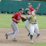 Mat-Sus Erik Webb tries to avoid the tag of Peninsula Oilers infielder Victor Carlino during a 5-0 win over the Oilers Friday, July 19, 2019, at Hermon Brothers Field In Palmer. Webb was caught in a rundown between second and third. (Photo by Jeremiah Bartz/Frontiersman)