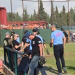 Nikiski and Kenai firefighters head to the dugout at the end of the seventh inning during the third annual Guns and Hoses charity baseball game at Coral Seymour Memorial Park in Kenai, Alaska on July 19, 2019. (Photo by Brian Mazurek/Peninsula Clarion)