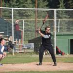 Brian Mazurek / Peninsula Clarion                                Nikiski firefighter Stephen Hartley steps up to the plate during the third annual Guns and Hoses charity baseball game Friday at Coral Seymour Memorial Park in Kenai. Local law enforcement and firefighters went head-to-head Friday night to raise money for the Nikiski Childrens Fund. The firefighters from Nikiski and Kenai put up a valiant effort, but the boys in blue ultimately won the game 6-5. Bailey Epperheimer, executive director for the Nikiski Childrens Fund, said that they were able to raise over $1,800 on Friday night, the most amount of money raised by the nonprofit from a single event.