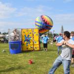 Brian Mazurek / Peninsula Clarion                                A participant in the 2019 Disability Pride Celebration in Soldotna Creek Park tries his hand at the dunk tank Saturday.