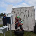 Chris Finley and his daughters Aubree and Danni pose at the photo booth during the 2019 Disability Pride Celebration in Soldotna Creek Park on July 20, 2019. (Photo by Brian Mazurek/Peninsula Clarion)