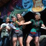 Members of the Kenai Watershed Forum sing an educational tune promoting the Stream Watch program during a break between bands on the Ocean Stage at Salmonfest on Saturday, Aug. 4, 2018 at the Kenai Peninsula Fairgrounds in Ninilchik, Alaska. (Photo by Megan Pacer/Homer News)
