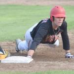 Peninsula Oilers Bobby Goodloe dives back safely to first base against the Anchorage Bucs on Wednesday, July 24, 2019, at Coral Seymour Memorial Park in Kenai, Alaska. (Photo by Jeff Helminiak/Peninsula Clarion)