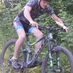 Mike Crawford negotiates a drop during Week 3 of the Soldotna Cycle Series on Thursday, July 18, 2019, at Tsalteshi Trails. (Photo by Jeff Helminiak/Peninsula Clarion)