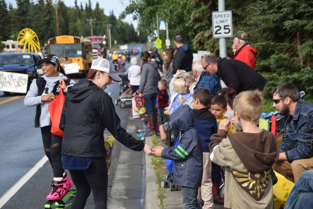 Jennifer Williams of KSRM hands out candy during Soldotnas Progress Day Parade in Soldotna, Alaska on July 27, 2019. (Photo by Brian Mazurek/Peninsula Clarion)