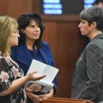 Rep. Colleen Leonard-Sullivan, R-Wasilla, left, Rep. Cathy Tilton, R-Wasilla, center, and Rep. Sarah Vance, R-Homer, speak together before a reconsideration vote HB 2002 at the Capitol on Monday, July 22, 2019. The three representatives voted no on the bill. (Michael Penn | Juneau Empire)