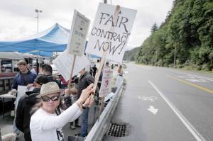 Michael Penn | Juneau Empire                                 Roland Lumbab mans the picket line with others on the third day of the Inland Boatmens Union of the Pacifics strike against the Alaska Marine Highway System at the Auke Bay Terminal on Friday in Juneau.