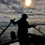 A dipnetter fishes on a boat in the Kenai River in July 2019. (Photo courtesy of Robert Valadez)