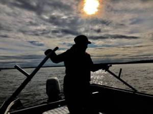 A dipnetter fishes on a boat in the Kenai River in July 2019. (Photo courtesy of Robert Valadez)