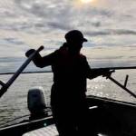 Photo courtesy of Robert Valadez                                A dipnetter fishes on a boat in the Kenai River in July.