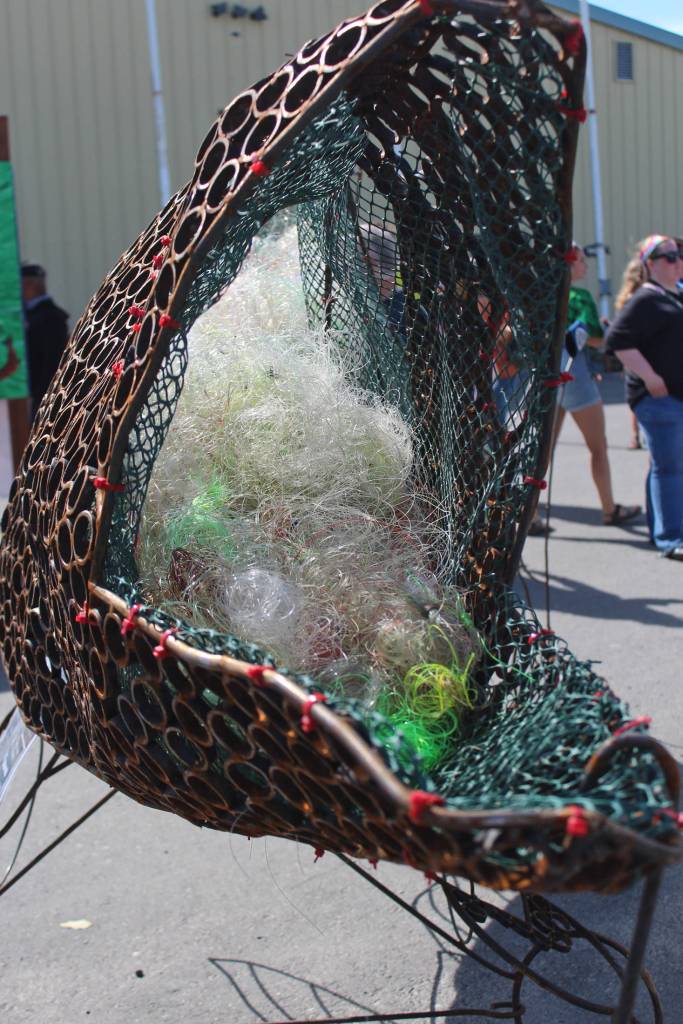 Sally, a salmon statue in front of the Kenai Watershed tent, serves as a reminder to passersby about the importance of keeping the oceans clean of fishing line on Friday, Aug. 2, 2019 at Salmonfest in Ninilchik, Alaska. (Photo by Megan Pacer/Homer News)