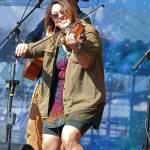 Nicole Campanale, fiddle player for Seward band Blackwater Railroad Company, performs with the band on the River Stage on Friday, Aug. 2, 2019 at Salmonfest in Ninilchik, Alaska. (Photo by Megan Pacer/Homer New