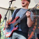 Ben Sayers, bass player for Blackwater Railroad Company, performs with the band on the River Stage on Friday, Aug. 2, 2019 at Salmonfest in Ninilchik, Alaska. (Photo by Megan Pacer/Homer News)                                Ben Sayers, bass player for Blackwater Railroad Company, performs with the band on the River Stage on Friday, Aug. 2, 2019 at Salmonfest in Ninilchik, Alaska. (Photo by Megan Pacer/Homer News)