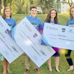Heather Marron of Alaska Communications presents the $1,500 awards to three peninsula teens (from right)  Anna DeVolld, Zachary Halstead and Carlee Rizzo  who were honored in the Summer of Heroes program, on Monday, Aug. 5, 2019, in Soldotna, Alaska. (Photo courtesy of Pegge Erkeneff/Kenai Peninsula Borough School District)