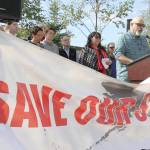 Vince Beltrami with the Alaska AFL-CIO, right, speaks at a news conference Wednesday in Anchorage. Beltrami and representatives from more than two dozen organizations are asking Alaska Gov. Mike Dunleavy to not cut money for early education and social service programs from the states budget. (AP Photo/Mark Thiessen)