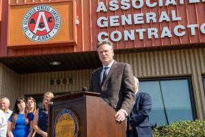 courtesy photo                                Gov. Mike Dunleavy speaks at the signing ceremony at the Alaska Association of General Contractors in Anchorage on Thursday.