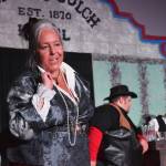 Yvette Tappana interacts with the audience during a rehearsel for Blazing Guns at Roaring Gulch held Thursday, Aug. 8, 2019, at the Kenai Performers stage in Soldotna. (Photo by Joey Klecka/Peninsula Clarion)